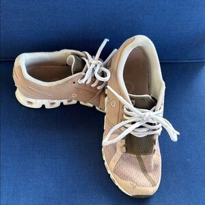 On Running Tan and White Athletic Shoes with Non-Marking Soles